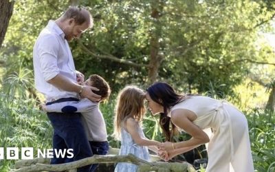 Harry and Meghan embrace children Archie and Lilibet in Christmas photo