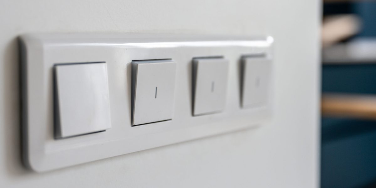 four-light-switches-macro-with-bokeh-background-minimal-design-scaled.jpg - PresaObiectiva