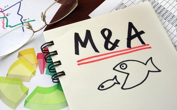 Carrefour și Garanti vând afaceri: Boom pe piața de fuziuni și achiziții în România