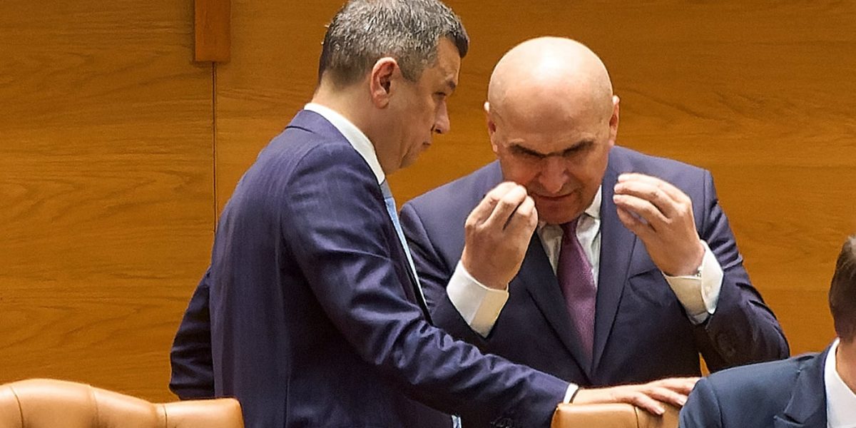 Bolojan, „diriginta” Isoscel: Ce se ascunde în spatele deciziei?